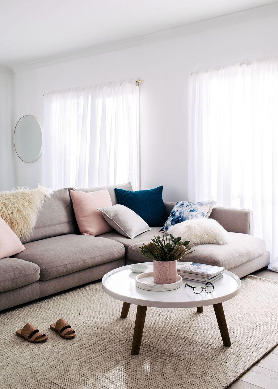 Pink and Blue Colorful Throw Pillows in Scandinavian Living Room via Jess Frazer Styling