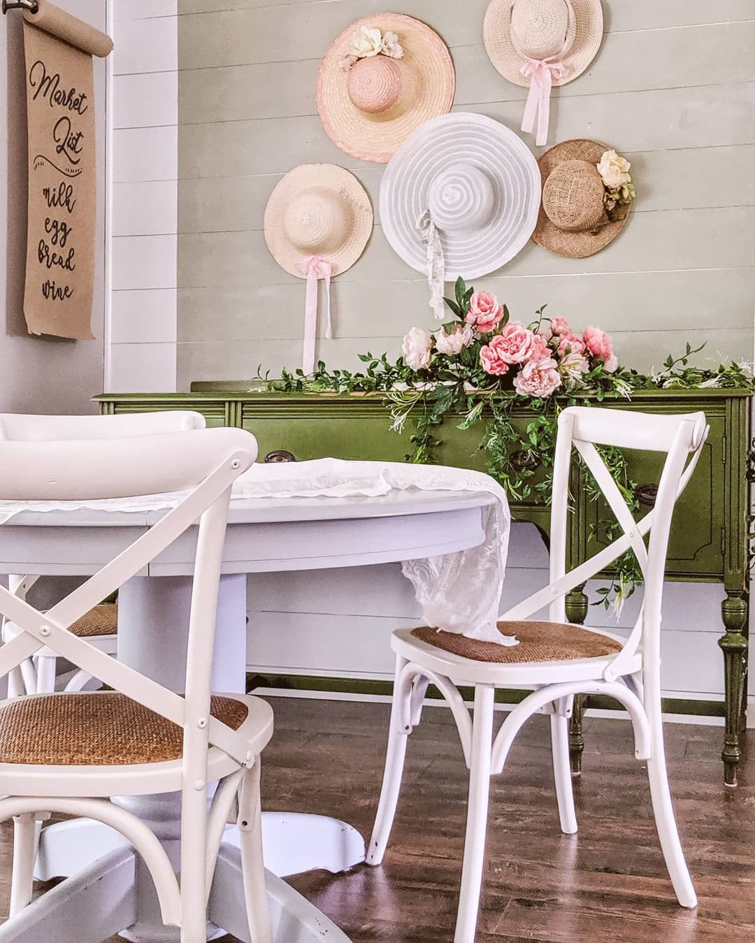 Round Pedestal Table and Hats on wall in French Country Breakfast Nook via @laureltrace