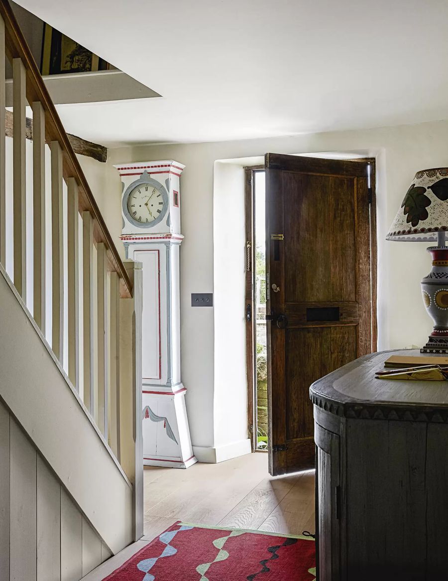 Rustic Door in English Country Entryway Design via Beata Heuman