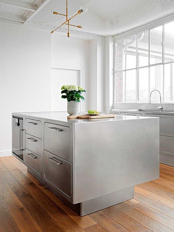 Silver Metal Locker Style Cabinets in Industrial Kitchen via Nuevo Estilo Abimis