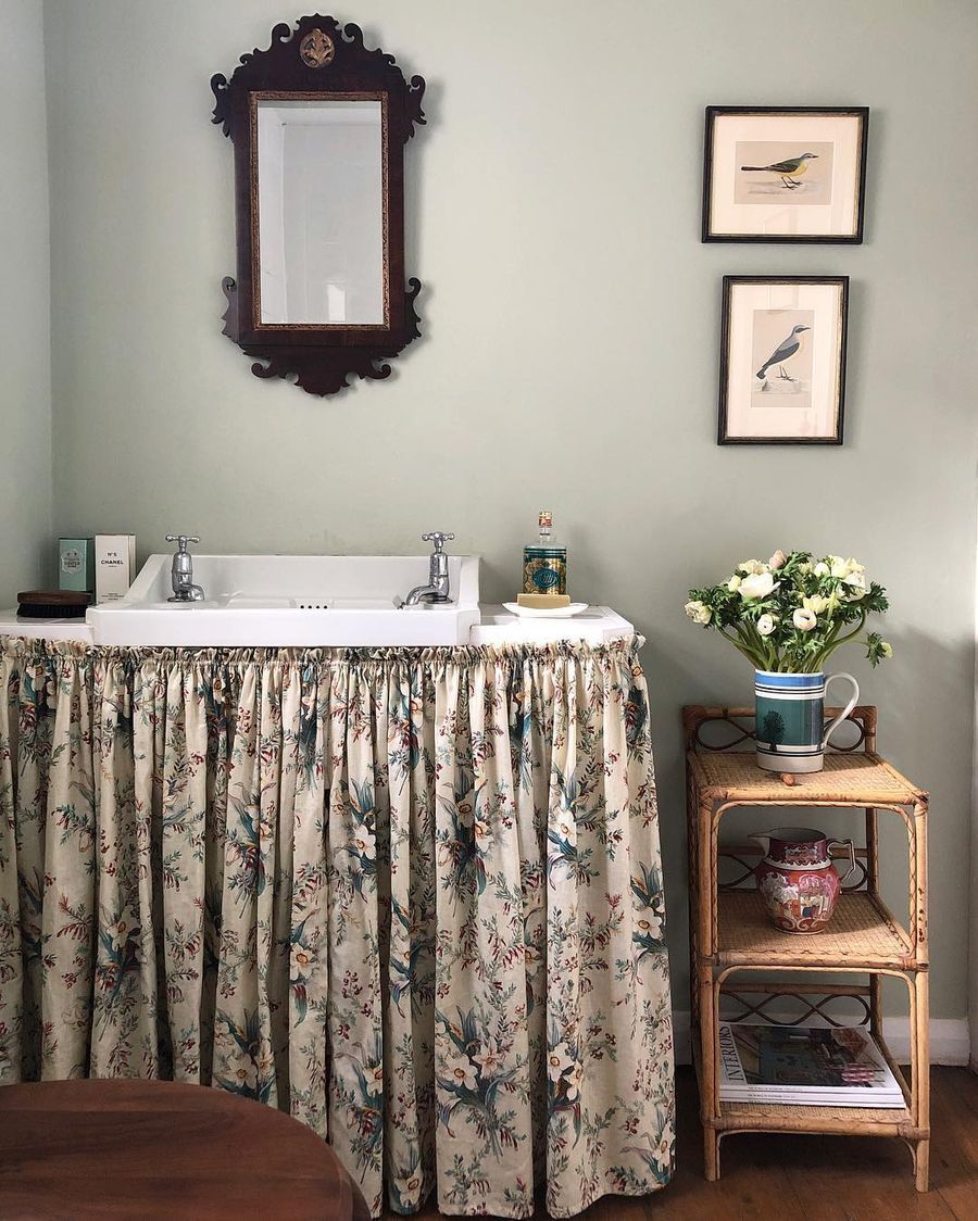 Skirted Sink English Country Bathroom with Curtain around the Bathroom sink via @carlosgarciainteriors
