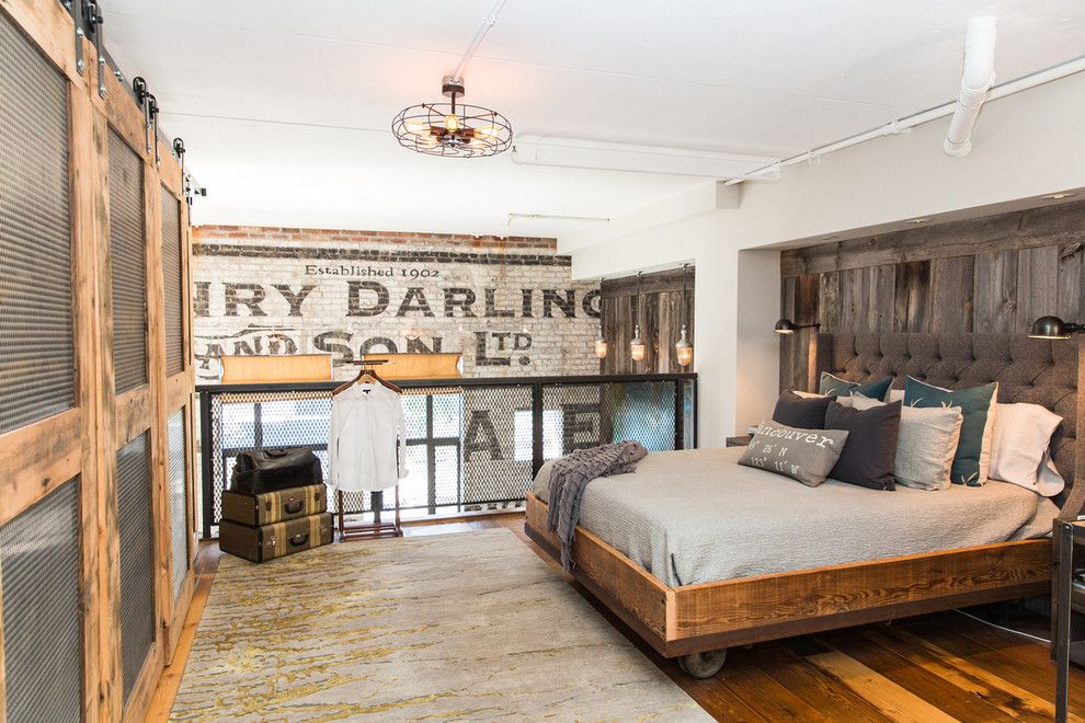 Sliding Wood Closet Doors in Industrial Bedroom Loft Design via Beyond Beige Interior Design