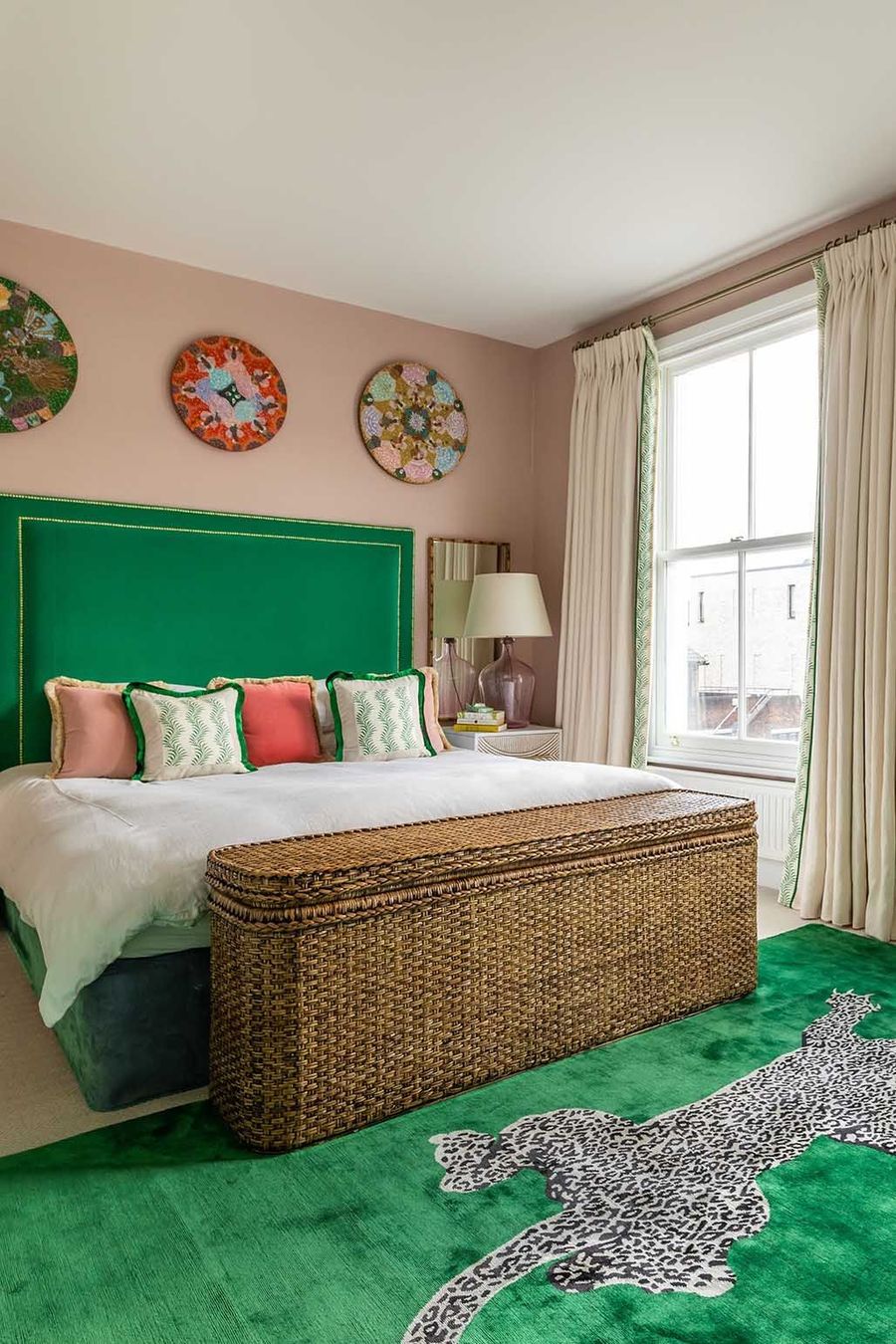 Wicker Storage Bench, Green Headboard, Pink walls, Tropical Bedroom via Barlow & Barlow