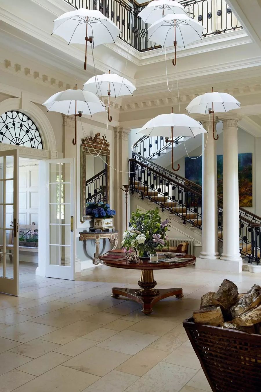 Umbrellas hanging down over Large English Country Foyer via Simon Upton