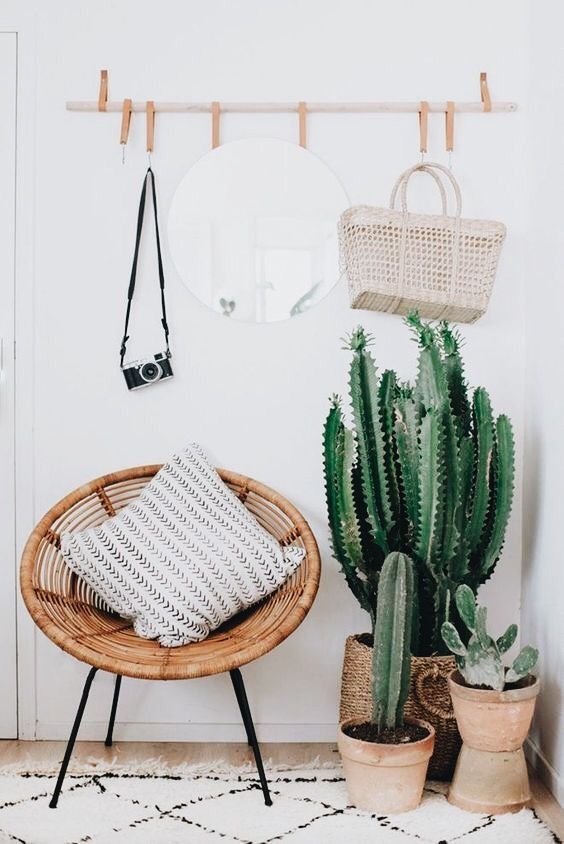 Wall Hooks made using wood rod with leather hooks above bohemian entrryway boho interior design