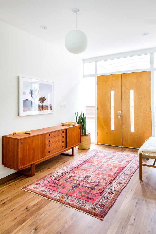 Warm Wood Sideboard in Mid-century Modern Entryway Decor via Natalie Myers