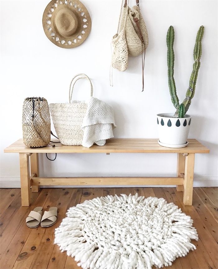 White Chunky Crochet Merino Rug and cactus house plant on wood bench in boho decor entryway ideas