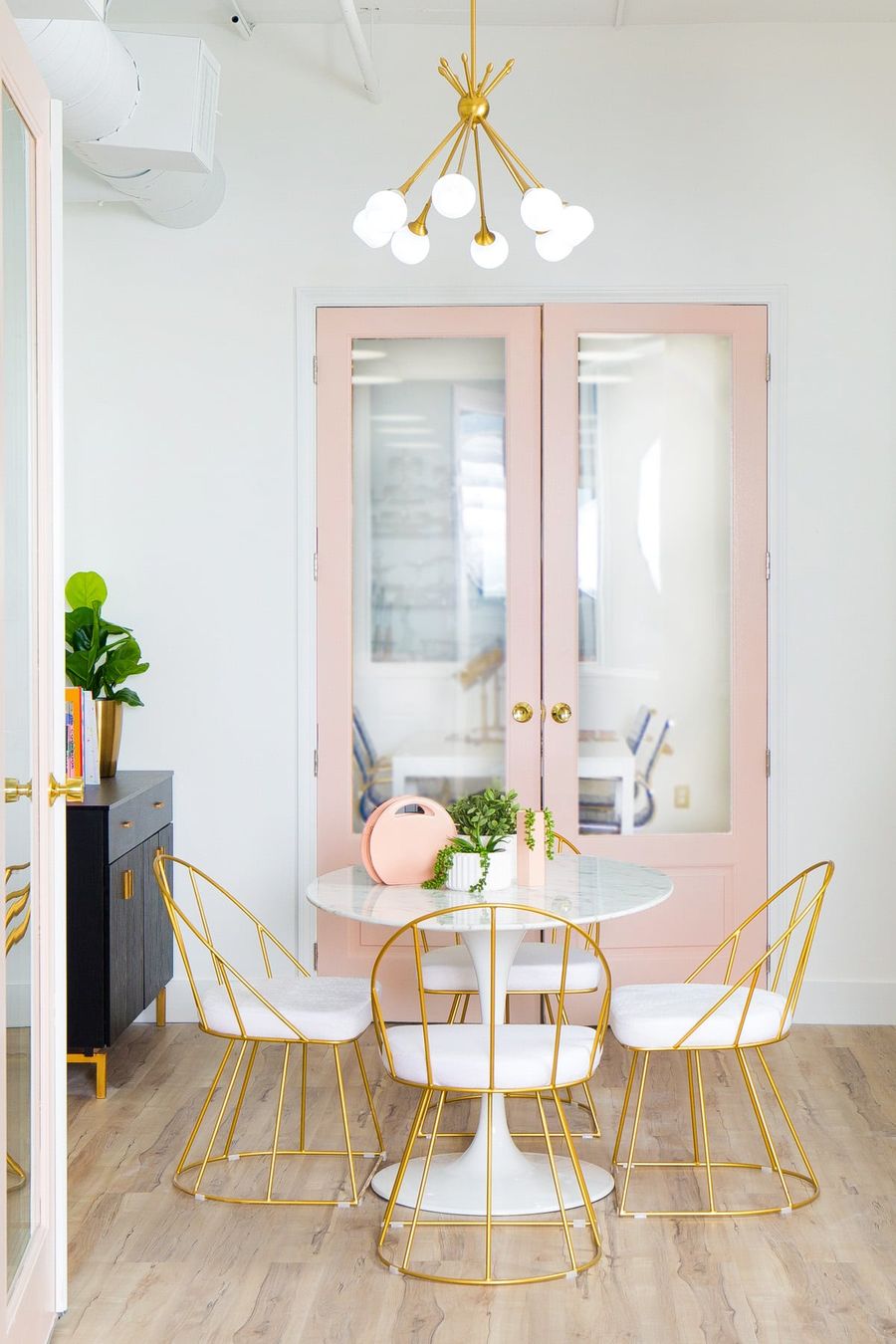 White Marble Tulip Table in Small Feminine Dining Room via sugarandcloth