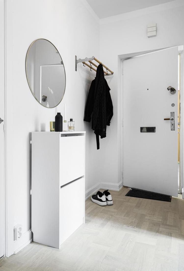 White Shoe Storage Cabinet in Scandinavian Entryway with Cabinet Storage via vaningen.se