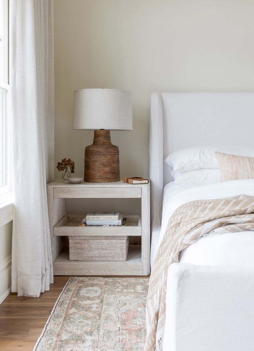Whitewashed wood Nightstand in Neutral Bedroom via Ursino Interiors