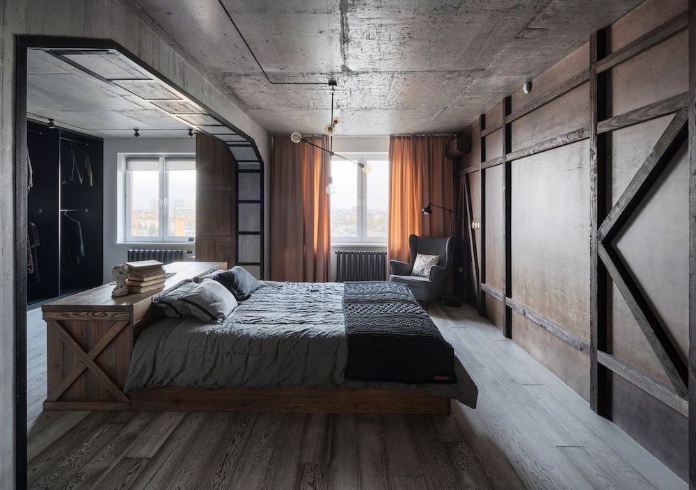 Wood Office Desk against bed in Industrial Bedrooom Decor via Igor Martin