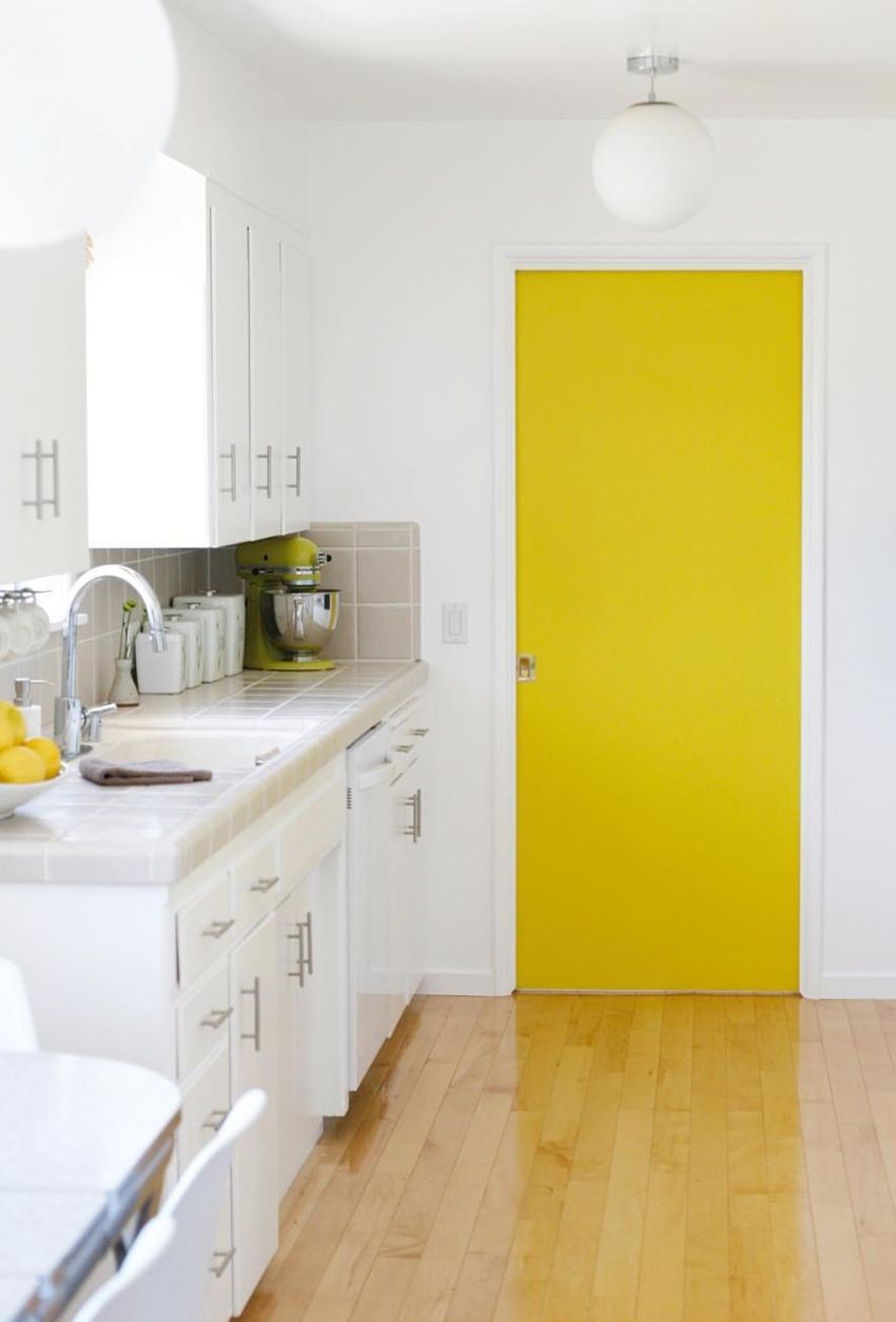 Yellow Accent Door in Mid-Century Modern Kitchen via @thejennyjames