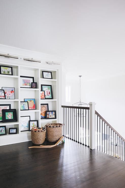 Staircase Landing Ideas with Gallery Wall via timber trails development