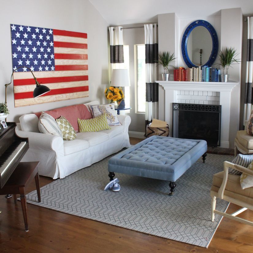 4th of July Home Decor with Wood Flag on wall above Sofa via thegirlswithglasses