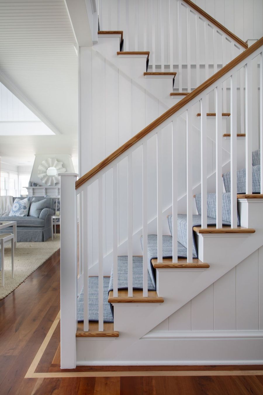 Blue runner and vertical shiplap walls Coastal Staircase decor via Elements of Style