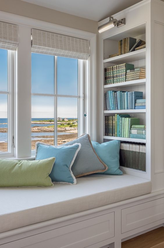 Built-in Window Bench and Bookshelves Coastal Reading Nook via Banks Design Associates