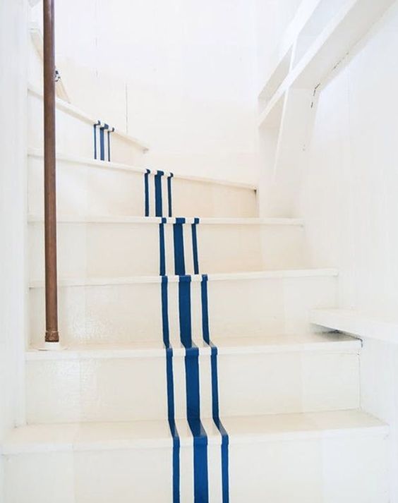 Coastal Staircase with Blue Stripes up the Center