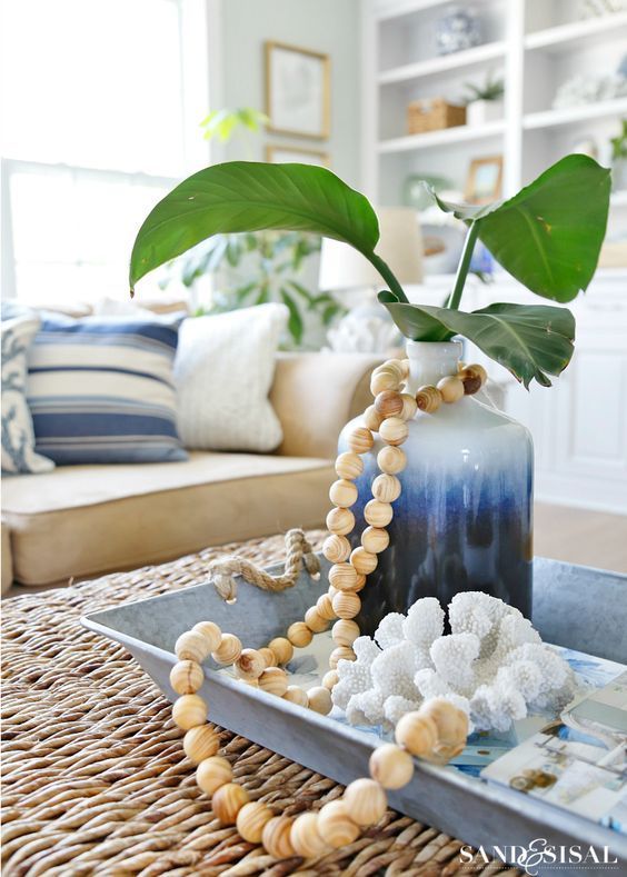 Coastal Vignette coffee table decor with Wood Bead Strand via Sand and Sisal