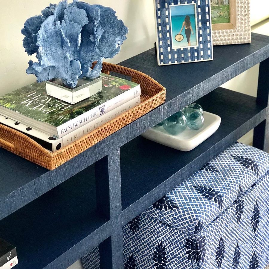 Coastal Vignette on Navy Console Table with rattan woven tray via @agk_designstudio