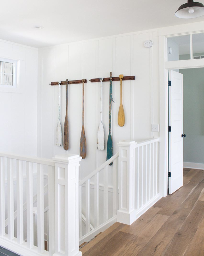 Oars on the wall Coastal Staircase Decor with Oars on the wall via @lilypadcottage