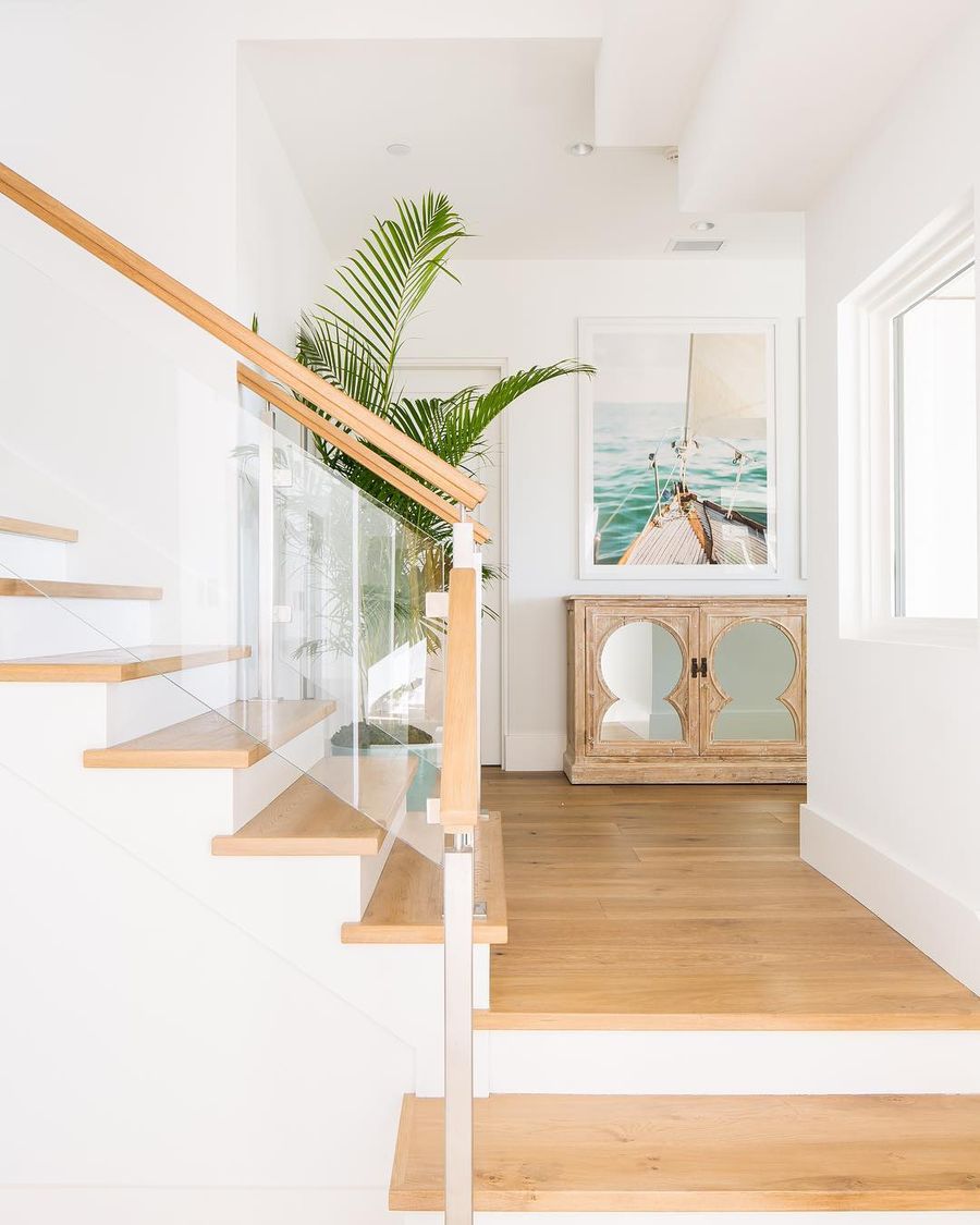 Palm tree decor and Coastal Staircase Landing @blackbanddesign