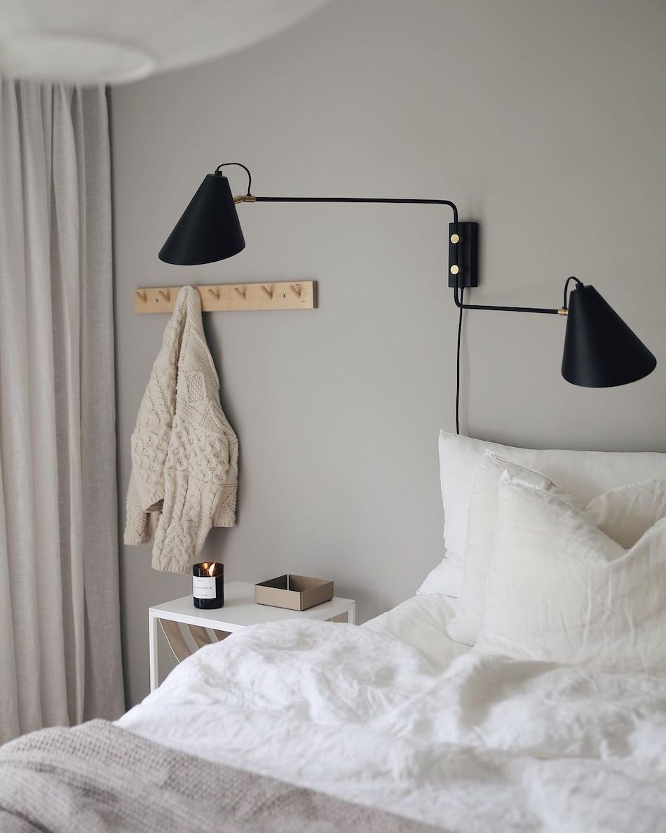 Scandinavian Swing Arm Lights above nightstand in bedroom via @emmamelins
