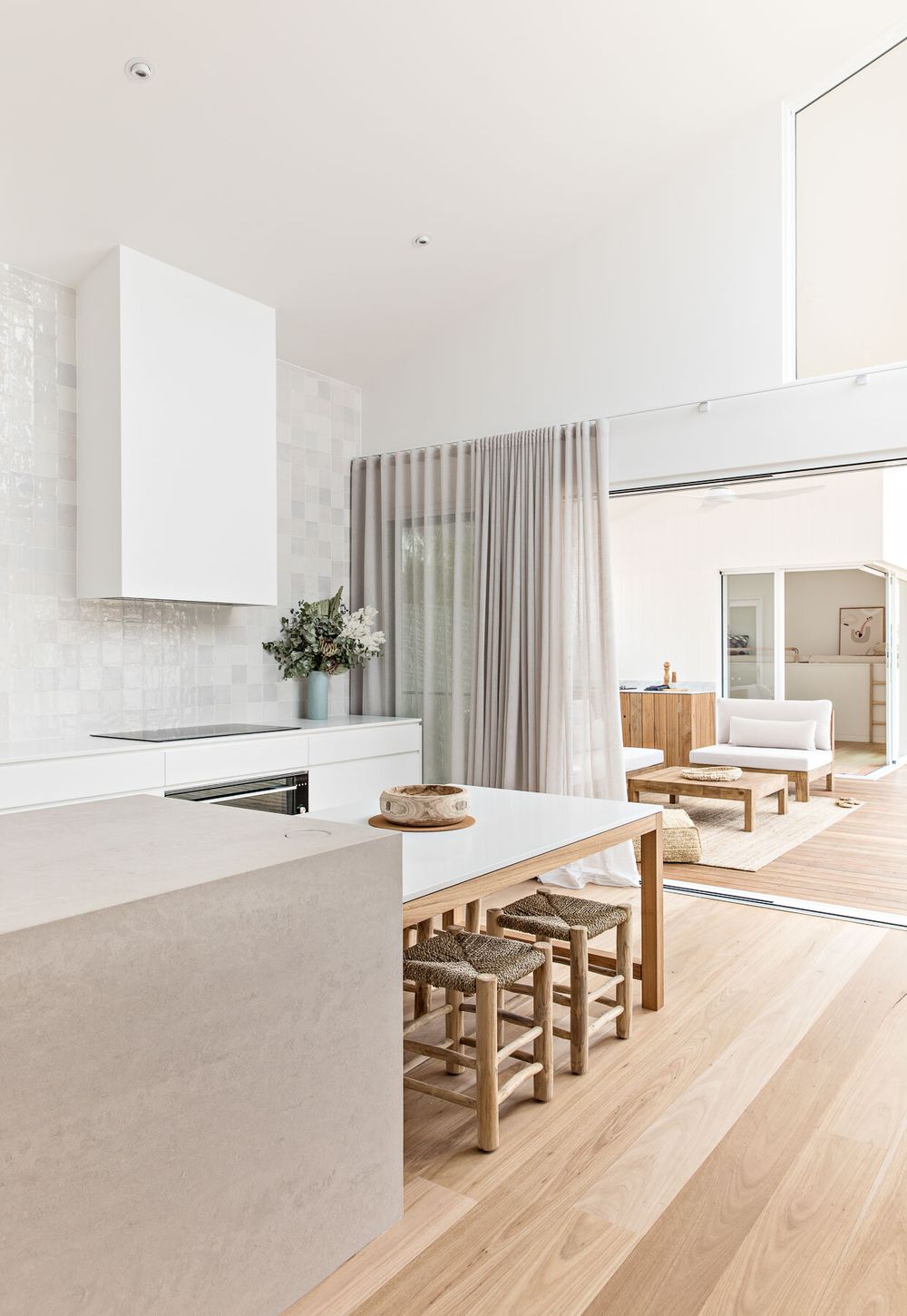 Kitchen Island with Dining Table at the End via ThePalmCo