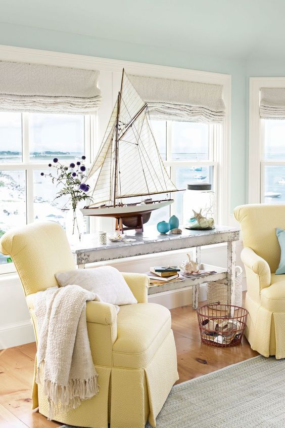 Coastal Living Room with Yellow Chairs via Country Living Magazine