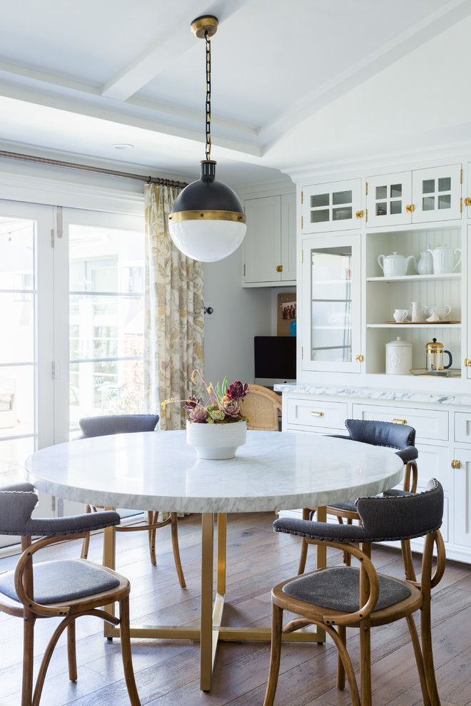 Glam breakfast nook with Round Marble Dining Table with Brass Legs via designstiles