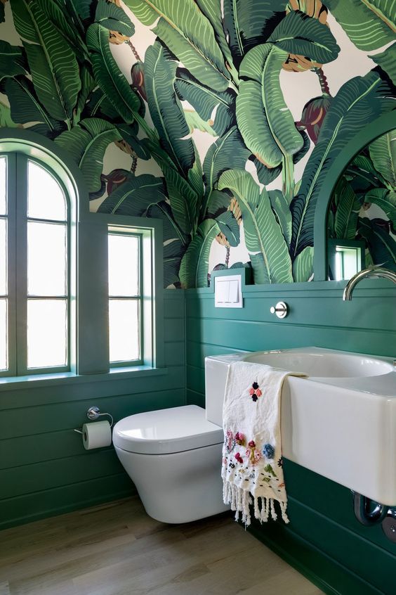 There's No Shortage Of Fun In This Tropical Modern Delray Oasis bathroom  with green tile shower, black iron frames and white sink on wood vanity -  Luxe Interiors + Design