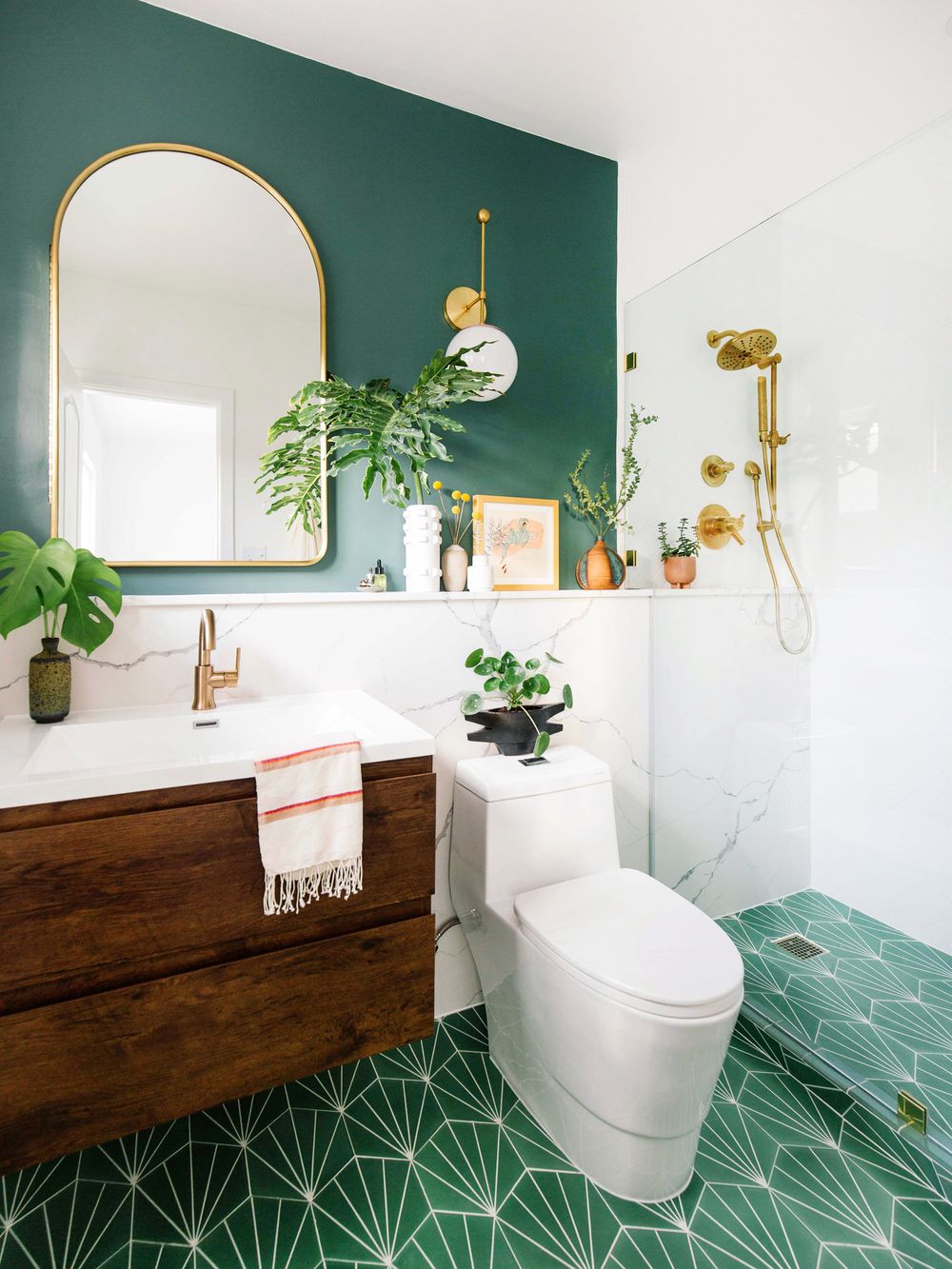 There's No Shortage Of Fun In This Tropical Modern Delray Oasis bathroom  with green tile shower, black iron frames and white sink on wood vanity -  Luxe Interiors + Design