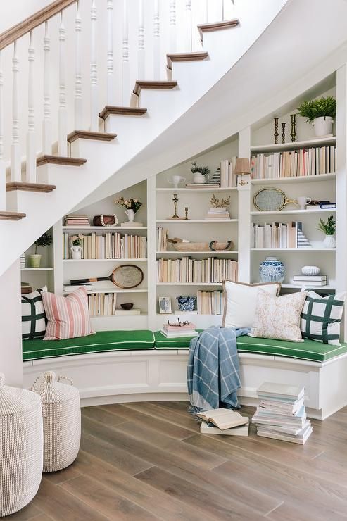Under the Staircase Reading Nook with Built-in Curved Bench via bria hammel interiors