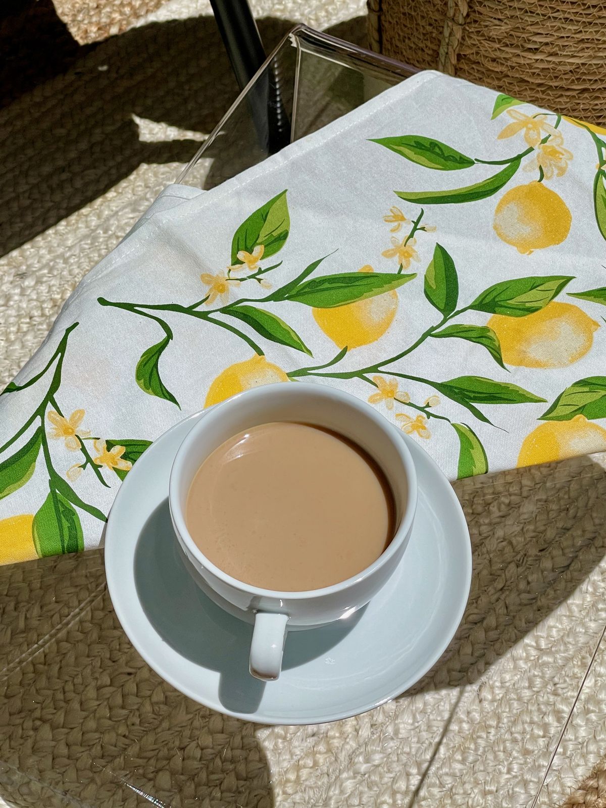Coffee Cup and Saucer with Lemon Cloth Napkin for a Yellow Citrus Summer Patio Design