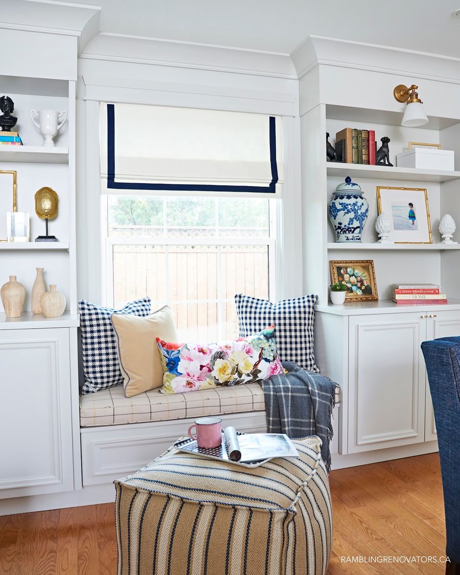 Window Seat between two built-in bookshelves via ramblingrenovators