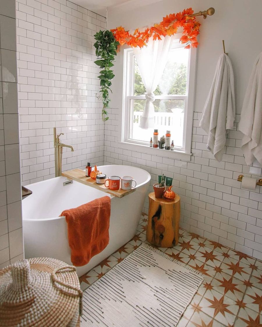 Fall garland on window fall bathroom decor ideas thetinydreamhome