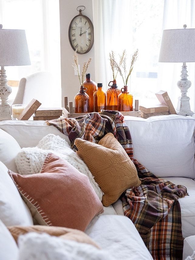 Fall living room plaid blankets via ellaclaireinspired
