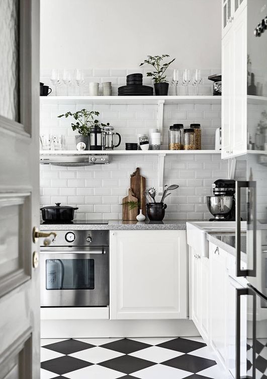 Minimalist Kitchen with Checkered Floors via stadshem.se
