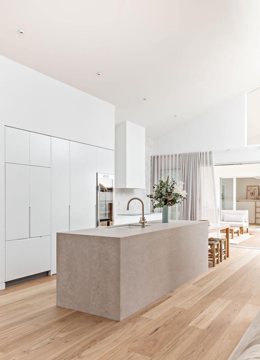 Minimalist kitchen with concrete kitchen island Orton Haus