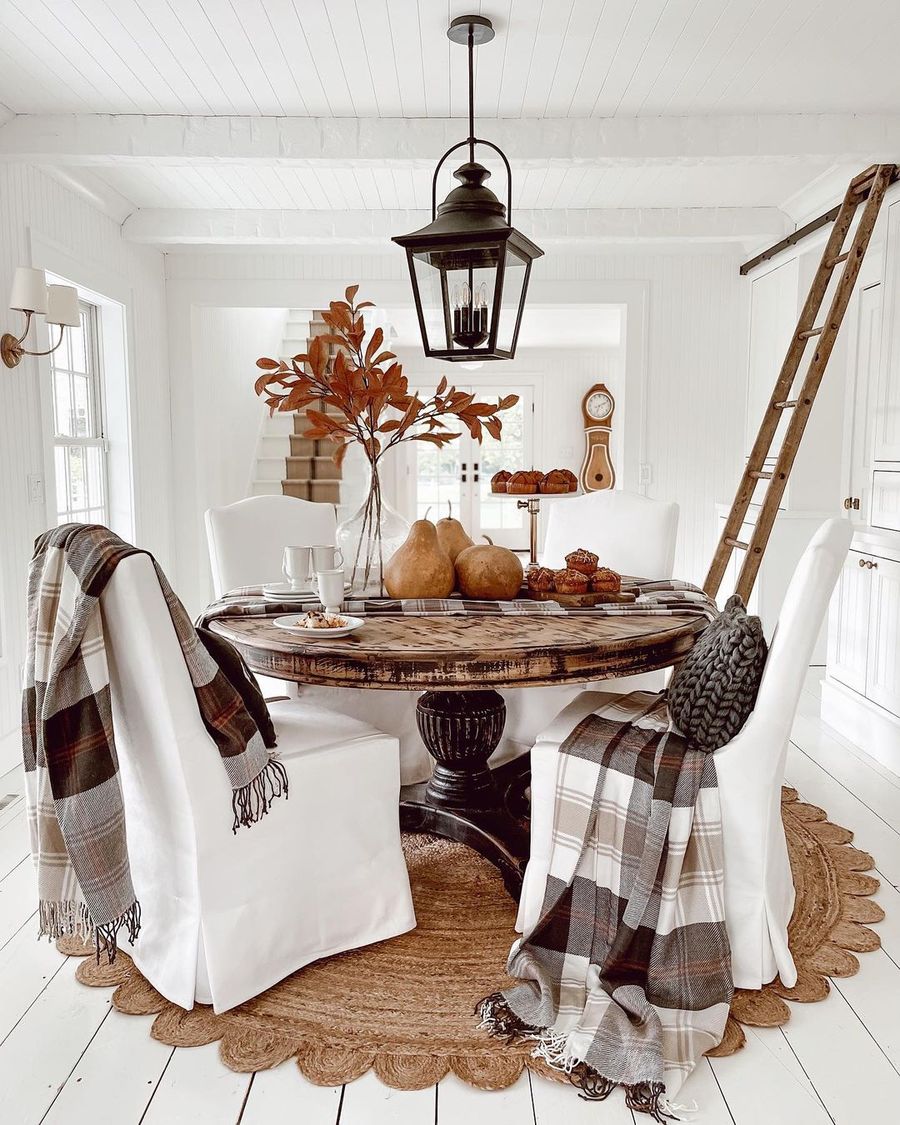 Plaid throw blankets on dining room chairs via lizmariegalvan