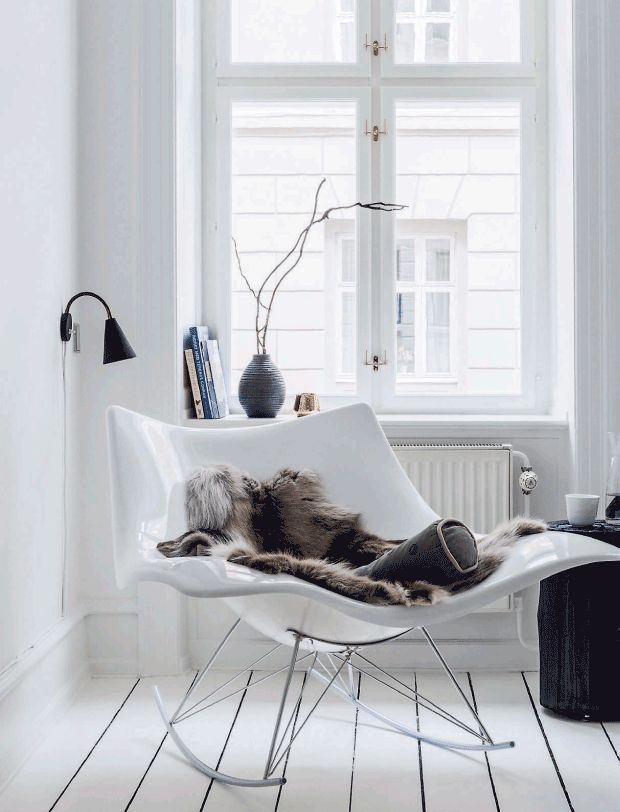 Scandi nordic reading nook design Plastic Molded Rocking Chair and Faux Fur Blanket via Helle Jensen