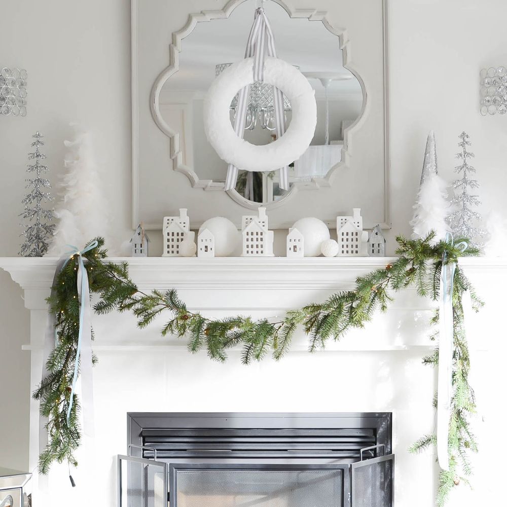 Christmas white houses on mantel via apopofpretty