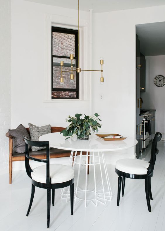 Minimalist Dining Room with Mixed Chairs