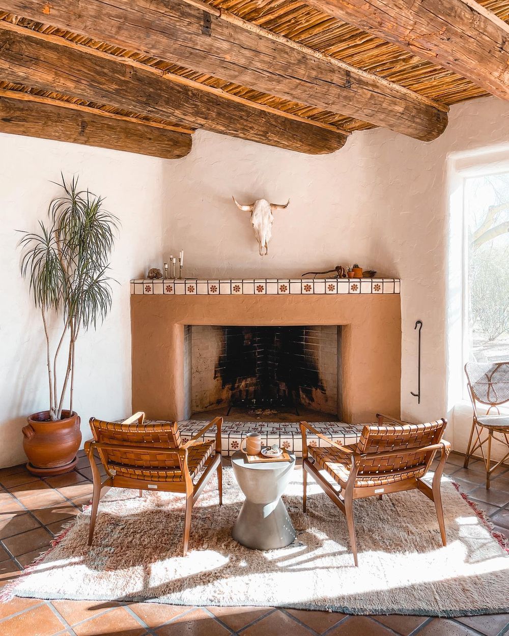 Southwest decor living room fireplace mid-century leather chairs thejoshuatreehouse