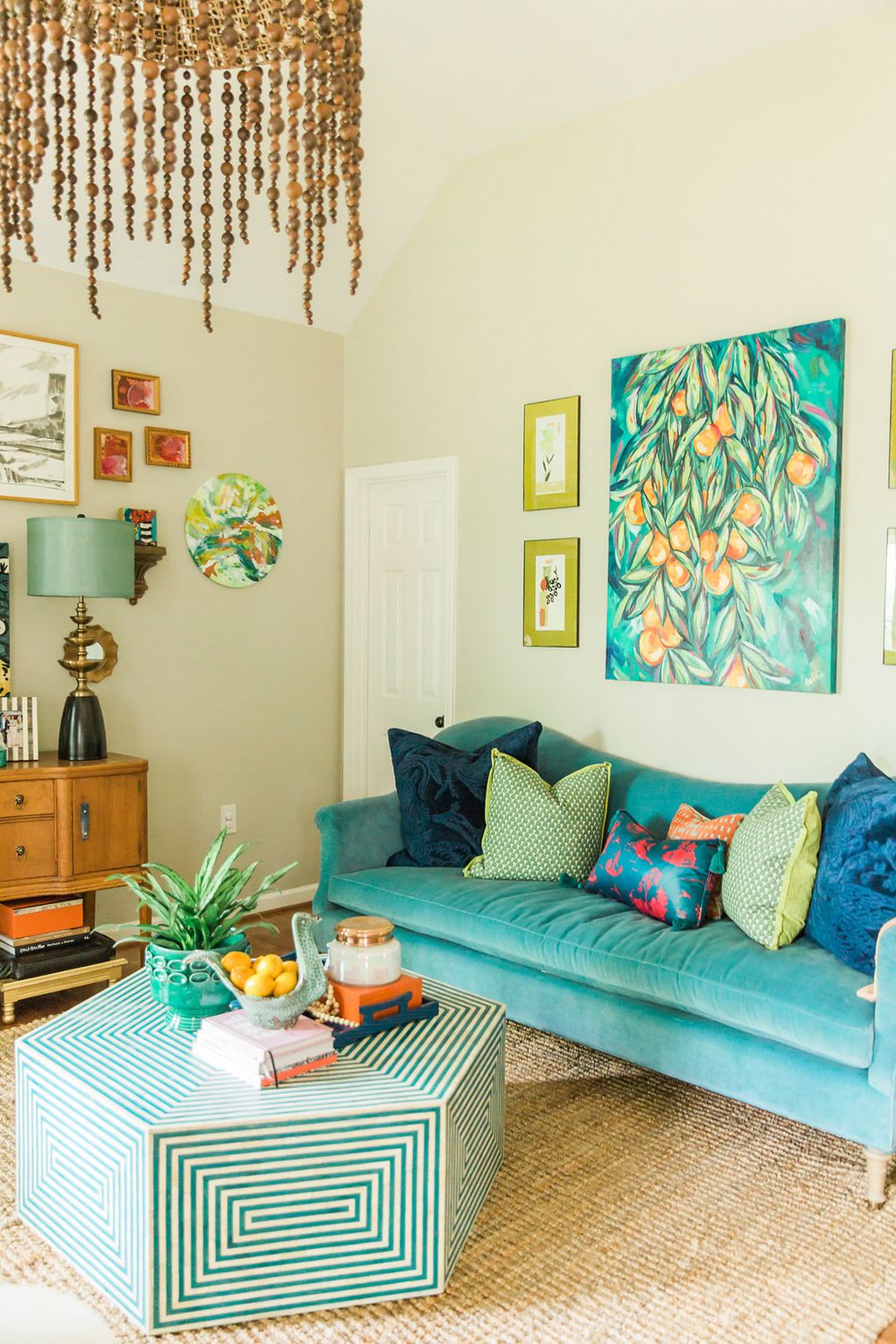 Velvet Turquoise Sofa Colorful Boho Living Room via amandalouiseinteriors