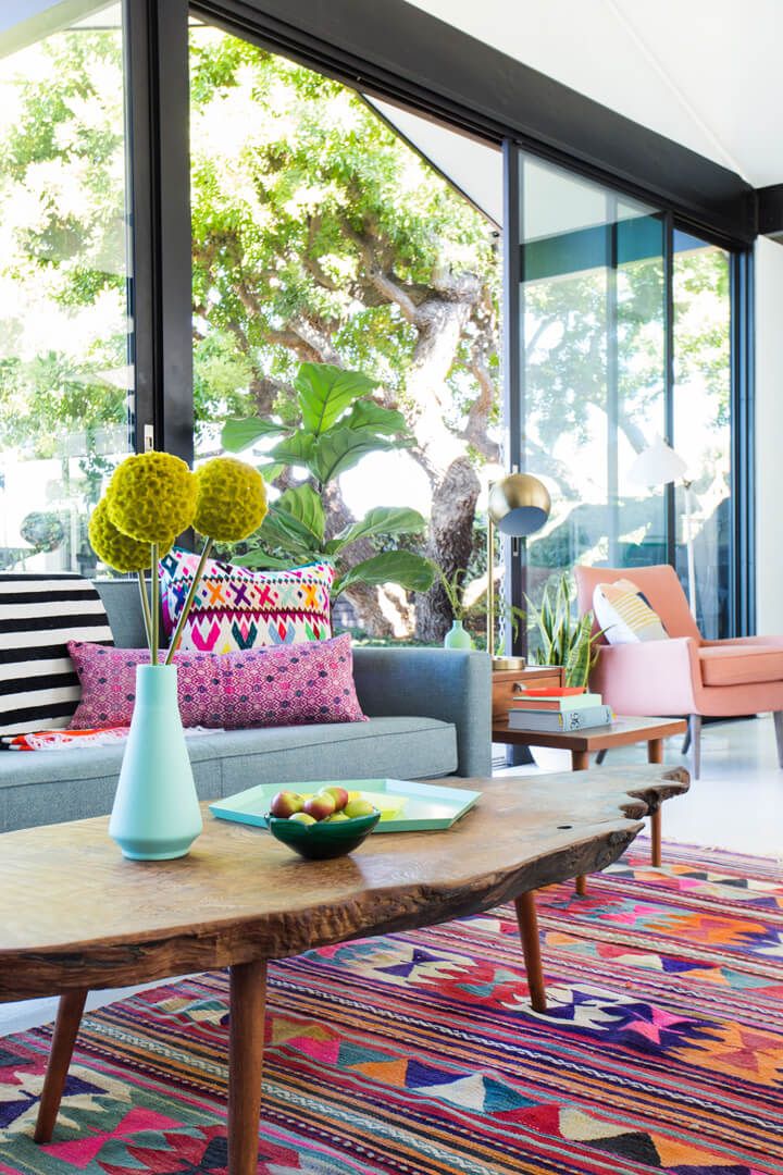 Colorful living room rug in colorful space via Emily Henderson