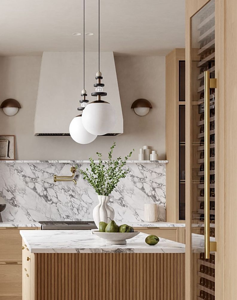 Marble kitchen countertops blonde wood cabinets @luma.interiors
