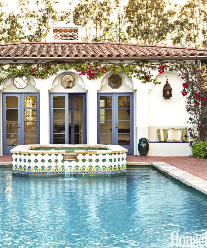 Spanish style home painted tiles by pool via HouseBeautiful