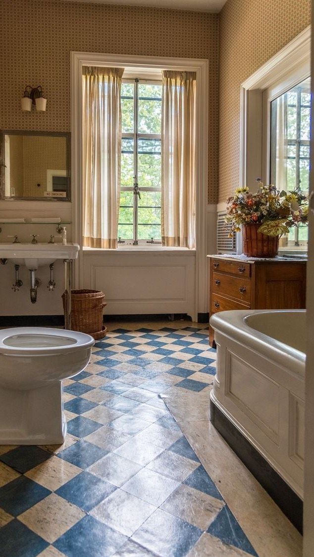 Checkered floors blue and white bathroom