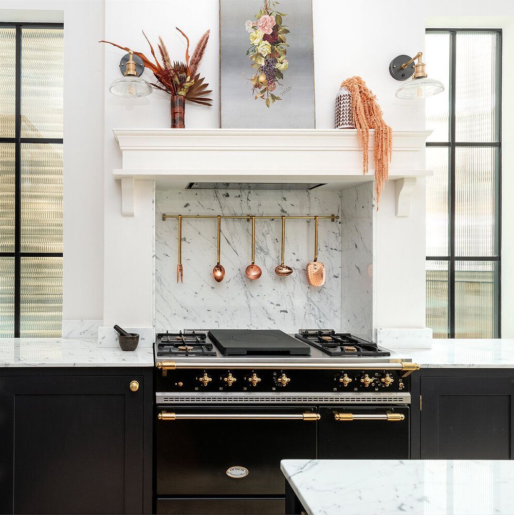 Black Kitchen Cabinets and Marble Backsplash Black Lacanche Range via @herringbonekitchens