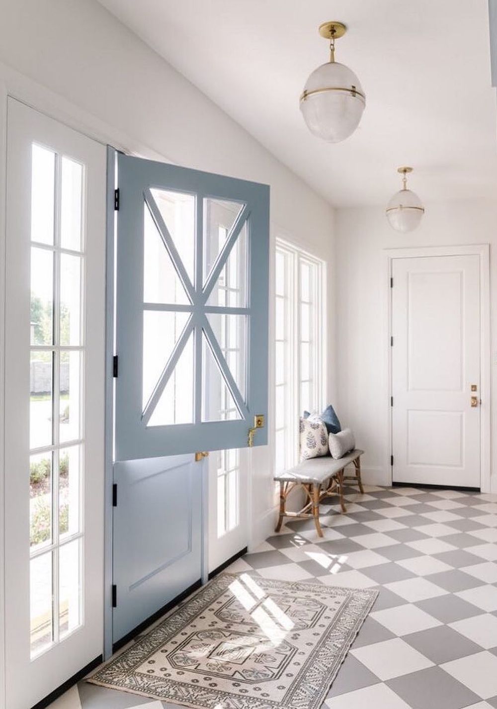 Pastel blue dutch doors @caitlincreerinteriors